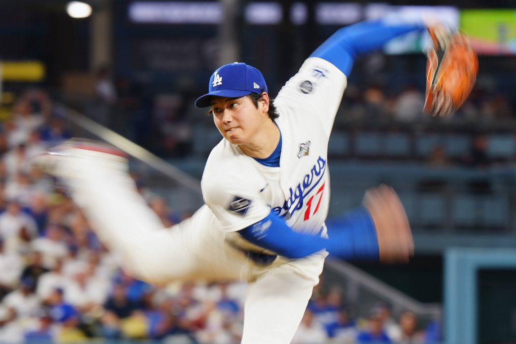 Los Angeles Dodgers pitcher Shohei Ohtani (17) delivers a pitch against the Toronto Blue Jays during fourth inning Game 4 World Series playoff MLB baseball action in Los Angeles on Tuesday, Oct. 28, 2025. (Frank Gunn/The Canadian Press via AP)