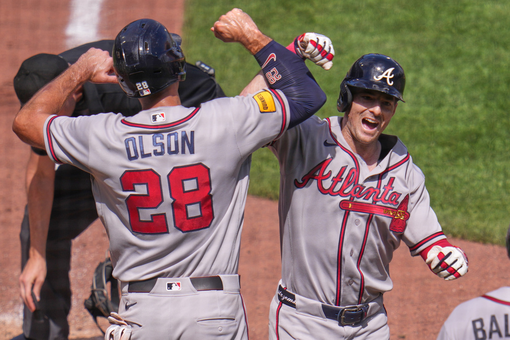 Atlanta Braves' Mike Yastrzemski, right, celebrates with Matt Olson as he crosses home plate after hitting a grand slam home run off Pittsburgh Pirates pitcher Dennis Santana during the ninth inning of a baseball game in Pittsburgh, Thursday, July 9, 2026. (AP Photo/Gene J. Puskar)