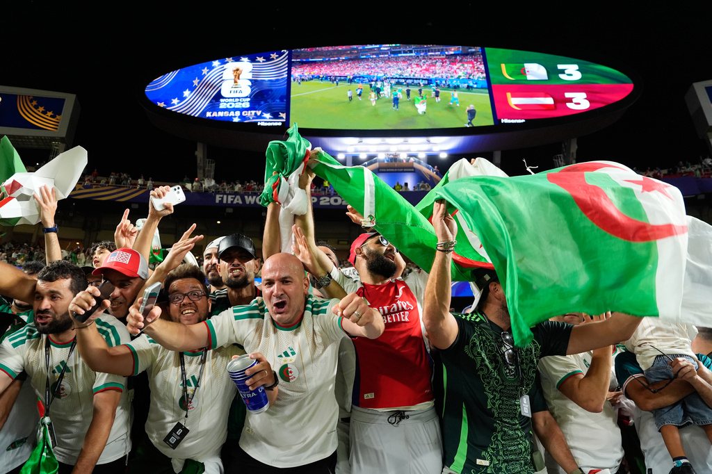 Fans cheer after the World Cup Group J soccer match between Algeria and Austria in Kansas City, Mo., Saturday, June 27, 2026. (AP Photo/Charlie Riedel)