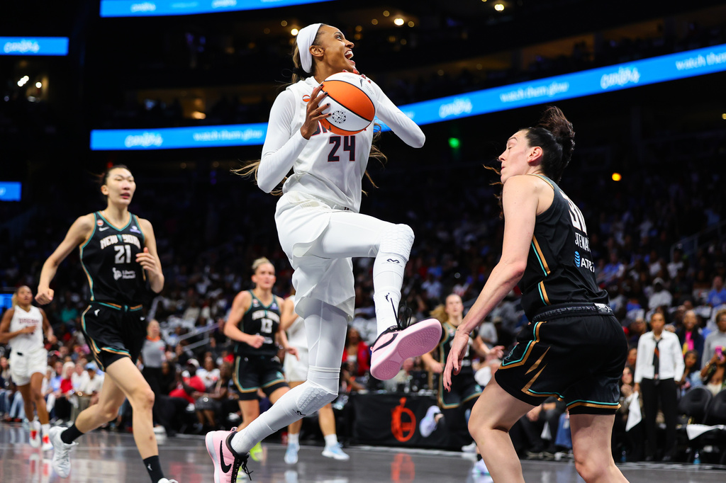 Atlanta Dream forward DeWanna Bonner (24) goes up to shoot against New York Liberty forward Breanna Stewart, right, during the first half of Game 1 of the WNBA basketball semifinals, Sunday, Oct. 4, 2026, in Atlanta. (AP Photo/Colin Hubbard)