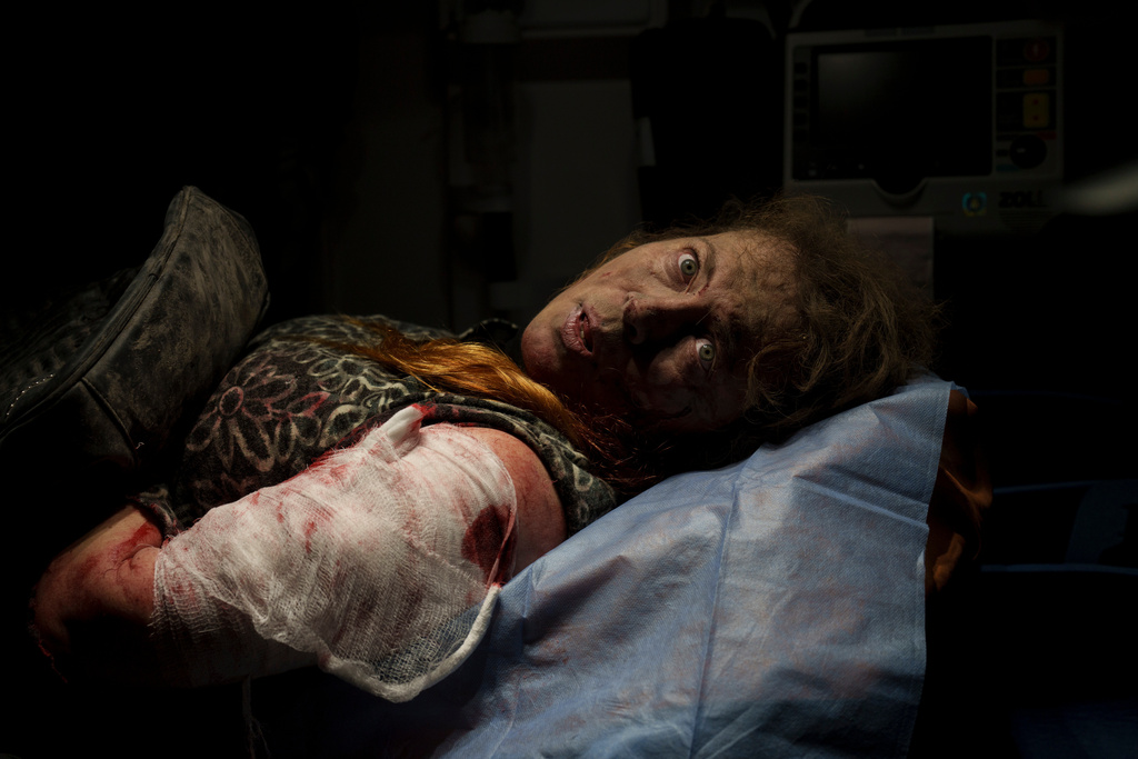 FILE - A person wounded in a Russian attack lies inside an ambulance before being taken to a hospital in Kherson, Ukraine, Thursday, Nov. 24, 2022. (AP Photo/Bernat Armangue, File)