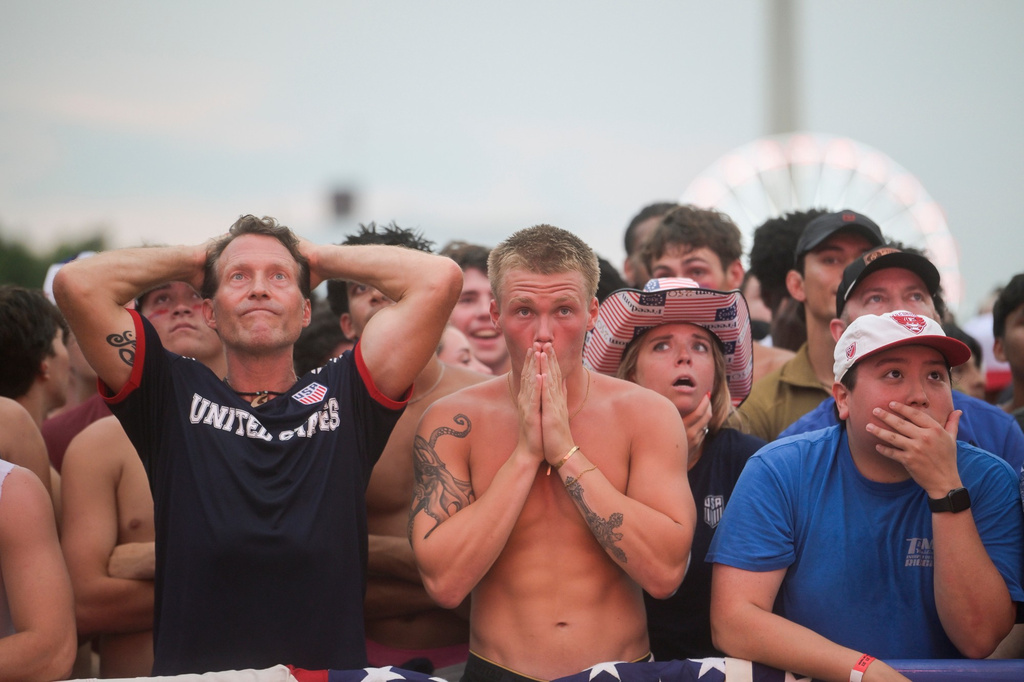People react after Belgium scored during the World Cup round of 16 soccer match between the United States and Belgium, Monday, July 6, 2026, at the FIFA Fan Zone on the National Mall in Washington. (AP Photo/Rod Lamkey, Jr.)