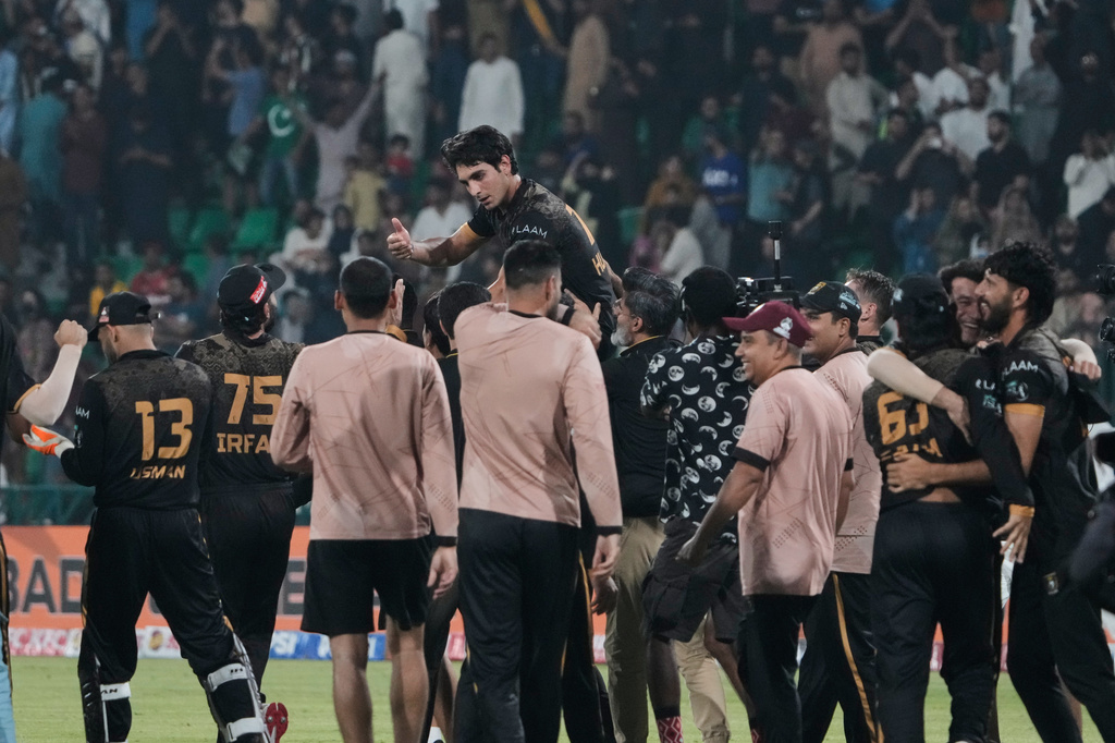 Hyderabad Kingsmen Hunain Shah, top center, celebrates with teammates after their team won the Pakistan Super League second eliminator cricket match against Islamabad United, in Lahore, Pakistan, Friday, May 1, 2026. (AP Photo/K.M. Chaudary)