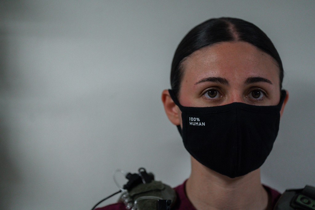 A masked federal agent waits outside an immigration courtroom, July 8, 2025, in New York. (AP Photo/Olga Fedorova, File)