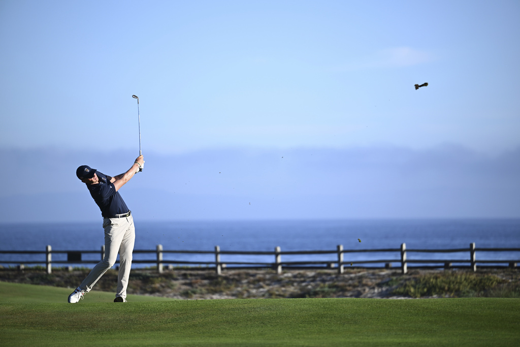 The USA team's Tommy Morrison hits along the first fairway during Walker Cup golf matches against the Great Britain and Ireland team at Cypress Point Club on Sunday, Sept. 7, 2025, in Pebble Beach, Calif. (AP Photo/Thien-An Truong )