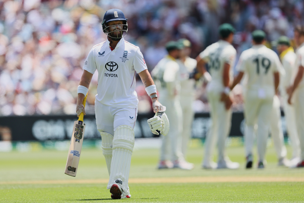 England's Ben Duckett walks from the field after he was dismissed during play on day four of the third Ashes cricket test between England and Australia in Adelaide, Australia, Saturday, Dec. 20, 2025. (AP Photo/James Elsby)