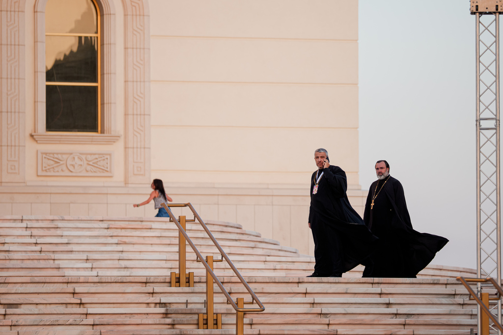 Romanian Orthodox priests walk before the Procession of Lights, part of a four-day program of the International Meeting of Orthodox Youth (ITO), in Bucharest, Romania, Wednesday, Sept. 2, 2026. (AP Photo/Andreea Alexandru)