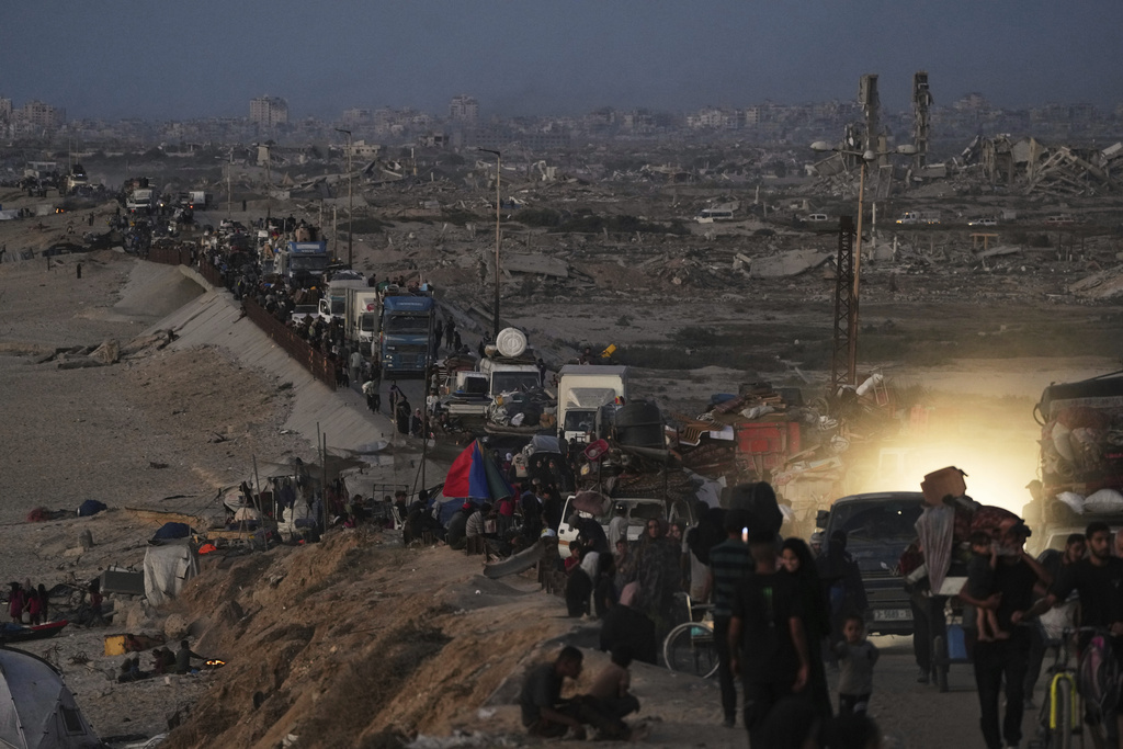 Displaced Palestinians flee northern Gaza along the coastal road toward the south, as Israel announced an expanded operation in Gaza City, Tuesday, Sept. 16, 2025. (AP Photo/Abdel Kareem Hana)