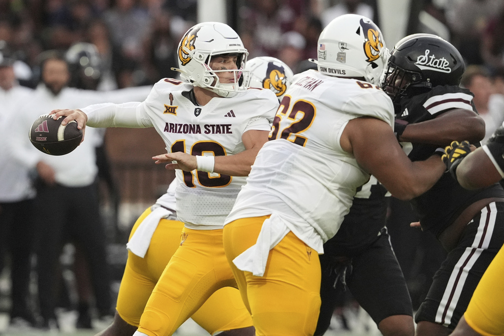 Arizona State quarterback Sam Leavitt (10) tries to pass while being pressured by a Mississippi State defensive player during the first half of an NCAA college football game in Starkville, Miss., Saturday, Sept. 6, 2025. (AP Photo/Rogelio V. Solis)