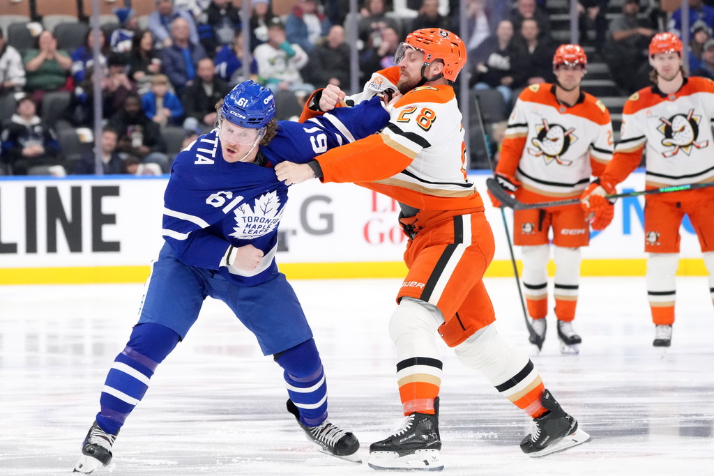 Toronto Maple Leafs Michael Pezzetta (61) fights with Anaheim Ducks Jeffrey Viel (28) during the first period of an NHL hockey game in Toronto, Thursday, March 12, 2026. (Nathan Denette/The Canadian Press via AP)