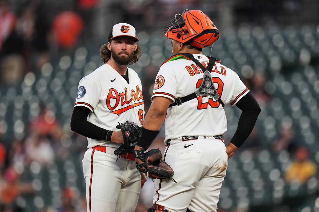 Baltimore Orioles starting pitcher Brandon Young, left, talks with catcher Samuel Basallo during a mound visit in the second inning of a baseball game against the Cleveland Guardians, Tuesday, Sept. 8, 2026, in Baltimore. (AP Photo/Stephanie Scarbrough)