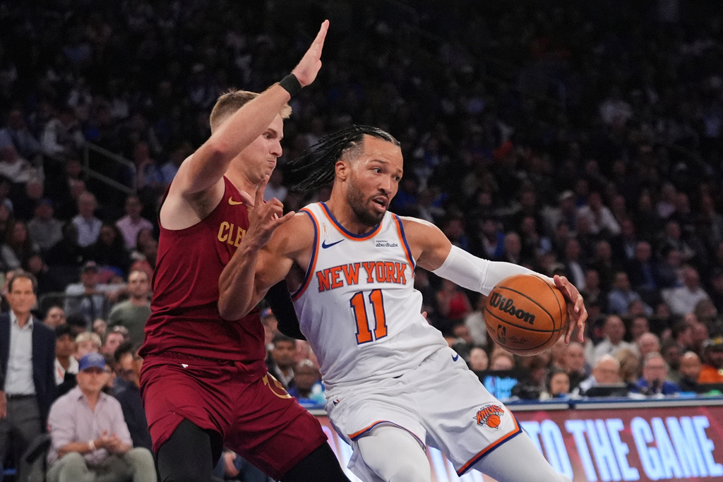 Cleveland Cavaliers' Sam Merrill (5) defends New York Knicks' Jalen Brunson (11) during the second half of an NBA basketball game Wednesday, Oct. 22, 2025, at Madison Square Garden in New York. (AP Photo/Frank Franklin II)