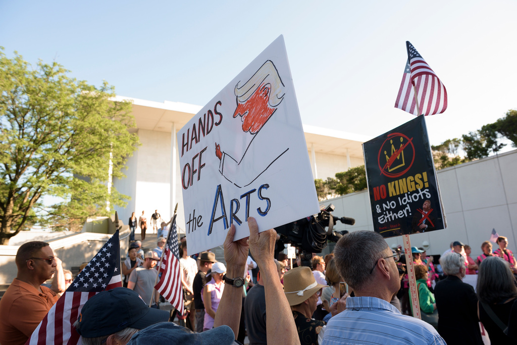 People hold a rally outside The John F. Kennedy Center for Performing Arts as they react to a judge's ruling in Washington, Friday, May 29, 2026. (AP Photo/Cliff Owen)