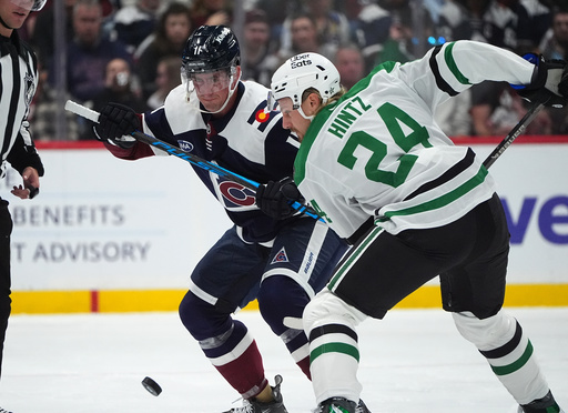 Colorado Avalanche center Brock Nelson (11) and Dallas Stars center Roope Hintz (24) fight for control of the puck in the first period of an NHL hockey game Saturday, Oct. 11, 2025, in Denver. (AP Photo/David Zalubowski) Colorado Avalanche center Brock Nelson (11) and Dallas Stars center Roope Hintz (24) fight for control of the puck in the first period of an NHL hockey game Saturday, Oct. 11, 2025, in Denver. (AP Photo/David Zalubowski)
