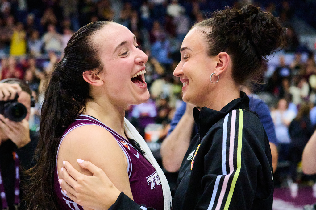 Toronto Tempo's Marina Mabrey, left, celebrates with her sister Michaela Mabrey after her team's win over the Los Angeles Sparks in a WNBA basketball game in Toronto, Thursday, June 25, 2026. (Sammy Kogan/The Canadian Press via AP)