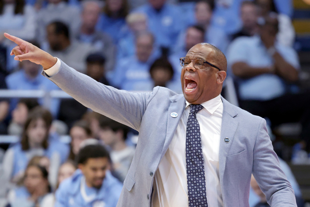 North Carolina head coach Hubert Davis yells instructions to the team during the first half of an NCAA college basketball game against Florida State, Tuesday, Dec. 30, 2025, in Chapel Hill, N.C. (AP Photo/Chris Seward)