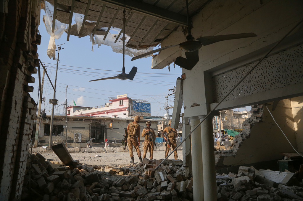 Army soldiers examine the site following a powerful bomb exploded at a mosque in Kohat, in northwestern Pakistan, Friday, Sept. 18, 2026. (AP Photo/Muhammad Sajjad)