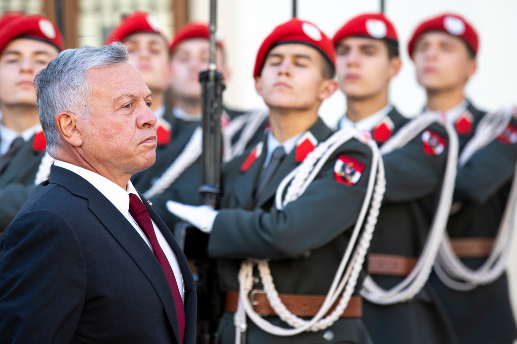 FILE - The King of Jordan, Abdullah II bin al-Hussein, left, attends a military ceremony with Austrian President Alexander Van der Bellen in Vienna, Austria, Monday, Oct. 25, 2021. (AP Photo/Lisa Leutner), File