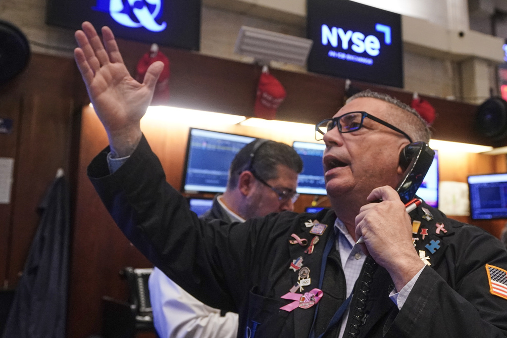 Trader Jonathan Mueller works on the floor of the New York Stock Exchange, Tuesday, Nov. 18, 2025. (AP Photo/Richard Drew)