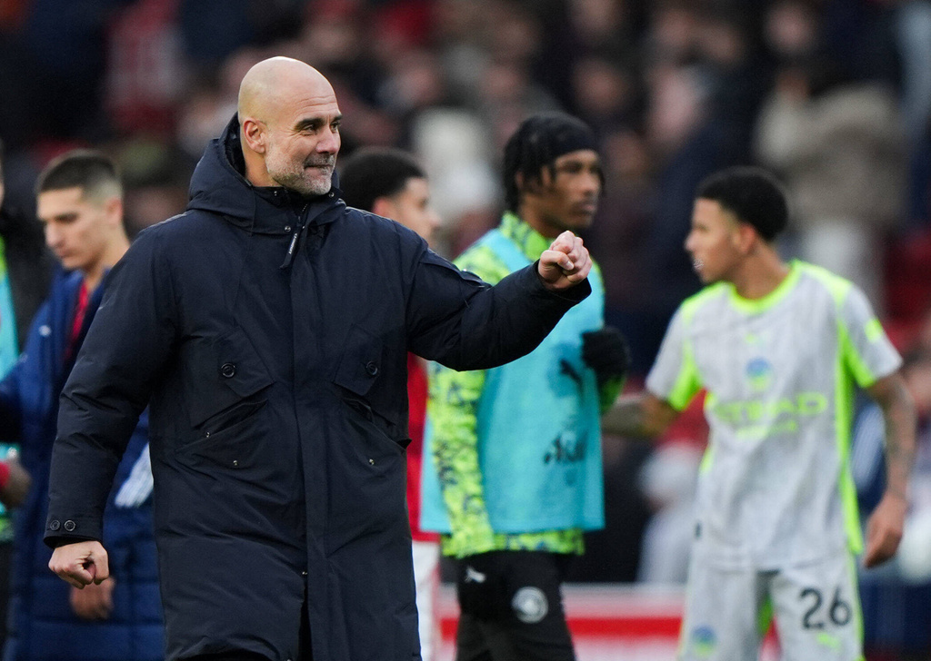 Manchester City manager Pep Guardiola celebrates at the end of the Premier League match between Nottingham Forest and Manchester City, in Nottingham, England, Saturday Dec. 27, 2025. (Joe Giddens/PA via AP)