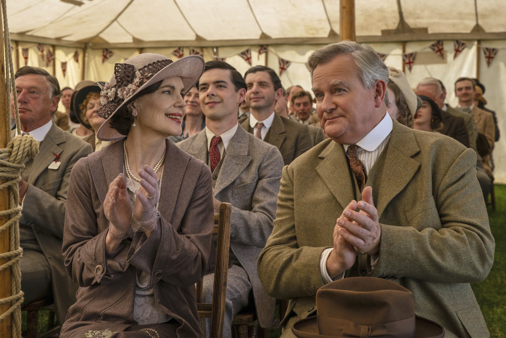 This image released by Focus Features shows Elizabeth McGovern, left, and Hugh Bonneville in a scene from the film "Downton Abbey: The Grand Finale." (Focus Feature via AP)