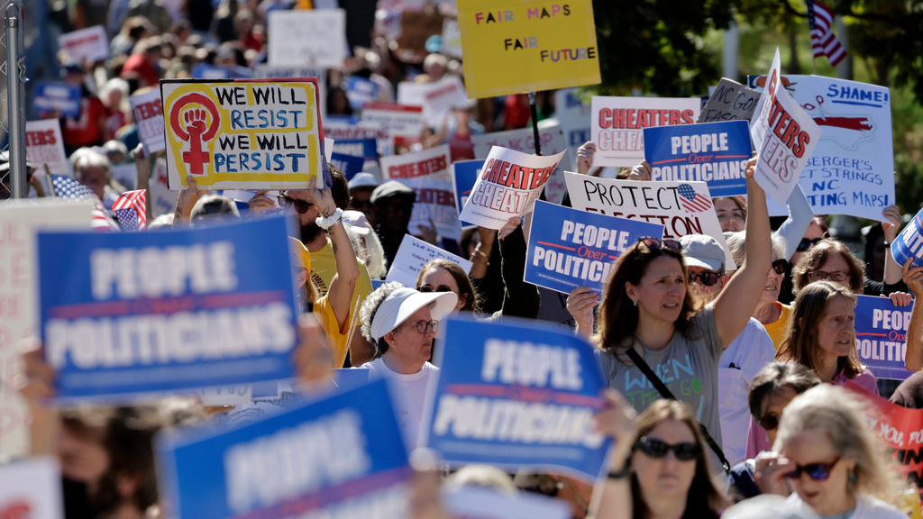 Marchers proceed from the Capitol during a rally protesting a proposed election redistricting map Tuesday, Oct. 21, 2025, in Raleigh, N.C. (AP Photo/Chris Seward)