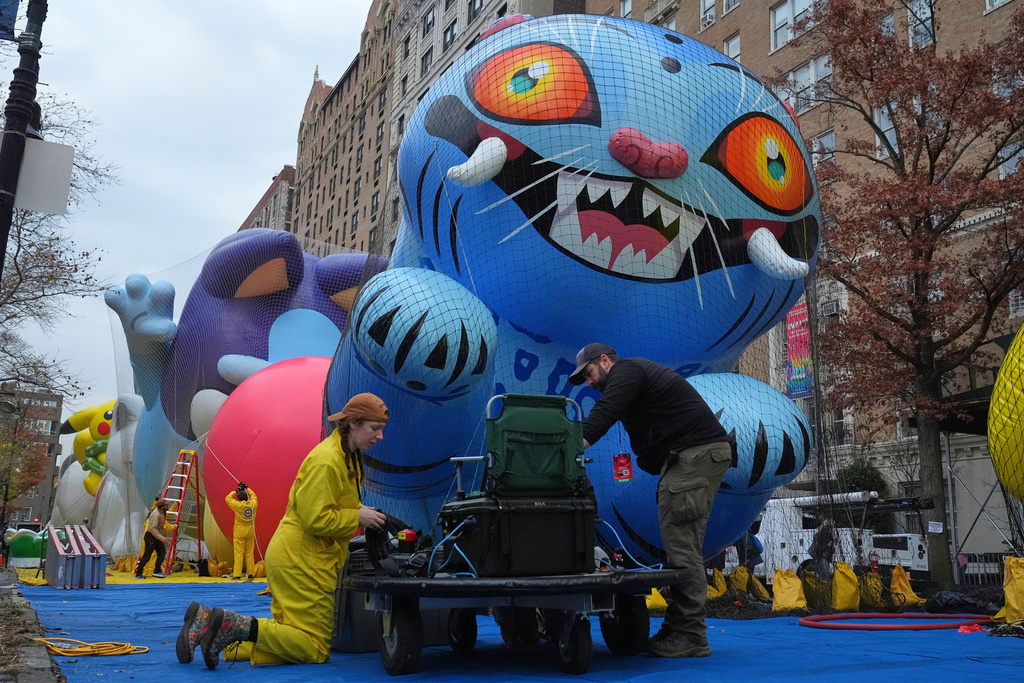 Volunteers work during the balloon inflation for the 99th Macy's Thanksgiving Day Parade Wednesday, Nov. 26, 2025, in New York. (AP Photo/Frank Franklin II)