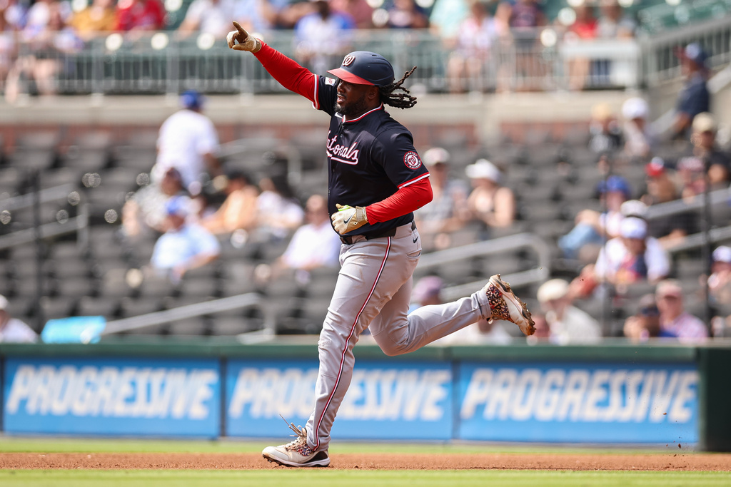 Washington Nationals' Josh Bell reacts after hitting a solo home run in the fourth inning of a baseball game against the Atlanta Braves, Wednesday, Sept. 24, 2025, in Atlanta. (AP Photo/Colin Hubbard)