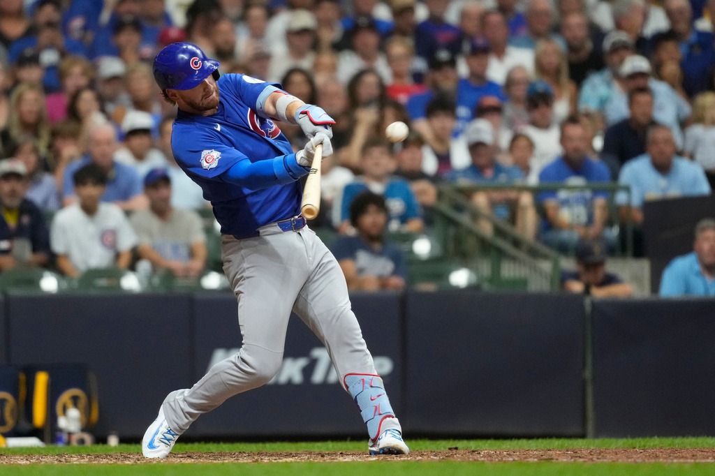 Chicago Cubs' Carson Kelly hits a go ahead two-run double during the ninth inning of a baseball game against the Milwaukee Brewers, Tuesday, Sept. 8, 2026, in Milwaukee. (AP Photo/Aaron Gash)