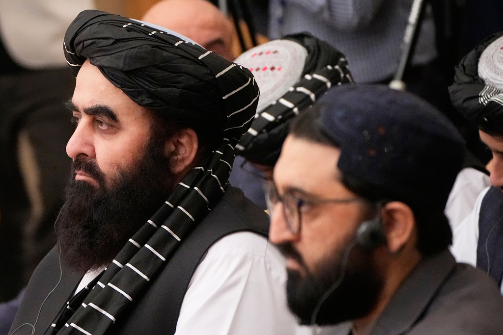 Afghanistan's acting Foreign Minister Amir Khan Muttaqi, left, attends the Moscow format consultations on Afghanistan in Moscow, Russia, Tuesday, Oct. 7, 2025. (AP Photo/Alexander Zemlianichenko)