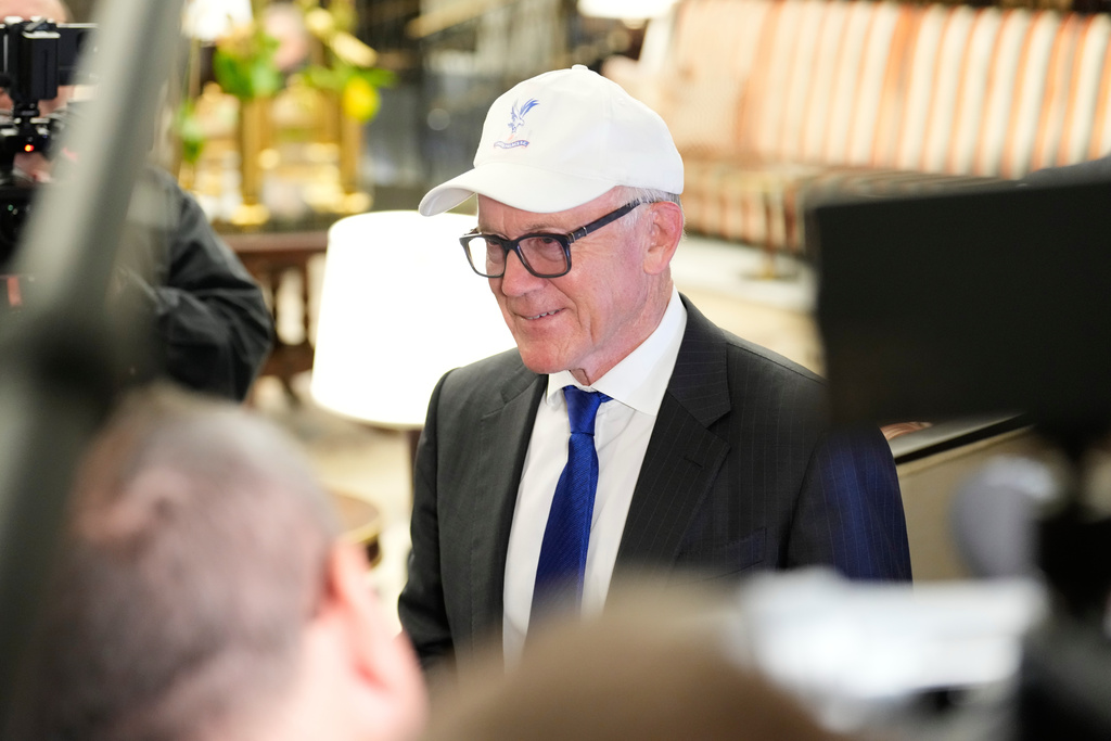 New York Jets owner Woody Johnson talks to reporters before attending an NFL owners meeting in New York, Tuesday, Oct. 21, 2025. (AP Photo/Seth Wenig)