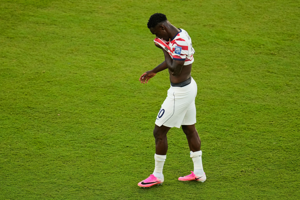 United States' Folarin Balogun (20) walks off the field after receiving a red card during the World Cup round of 32 soccer match between the United States and Bosnia in Santa Clara, Calif., near San Francisco, Wednesday, July 1, 2026. (AP Photo/Jeff Chiu)