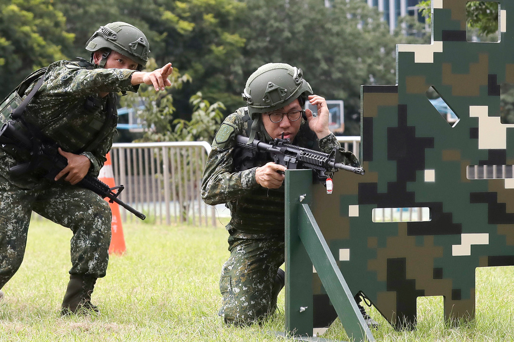 Soldiers conduct shooting training during the annual Han Kuang military exercises in Taipei, Taiwan, Wednesday, Aug. 5, 2026. (AP Photo/Chiang Ying-ying)