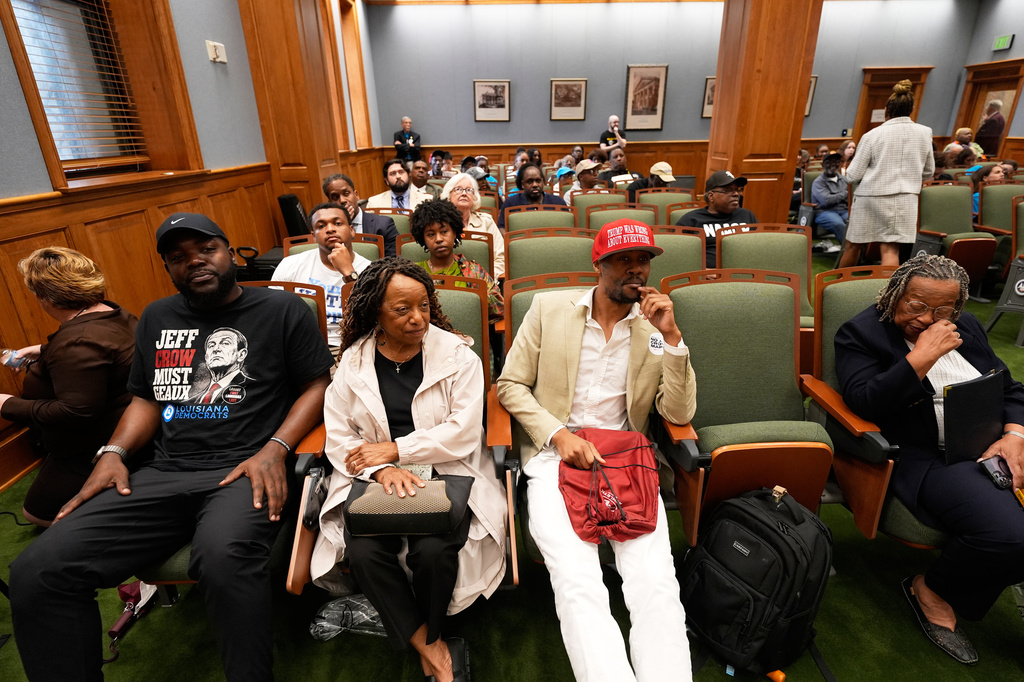 People watch and listen from an overflow room during a Louisiana House and Governmental Affairs Committee hearing over redistricting in Baton Rouge, La., Thursday, May 21, 2026. (AP Photo/Gerald Herbert)