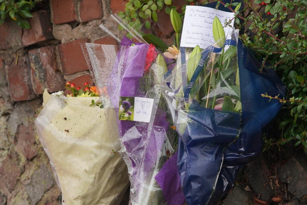 Flowers laid near by the scene of a stabbing incident at Heaton Park Hebrew Congregation synagogue, in Crumpsall, Manchester, England, Friday, Oct. 3, 2025. (AP Photo/Ian Hodgson)