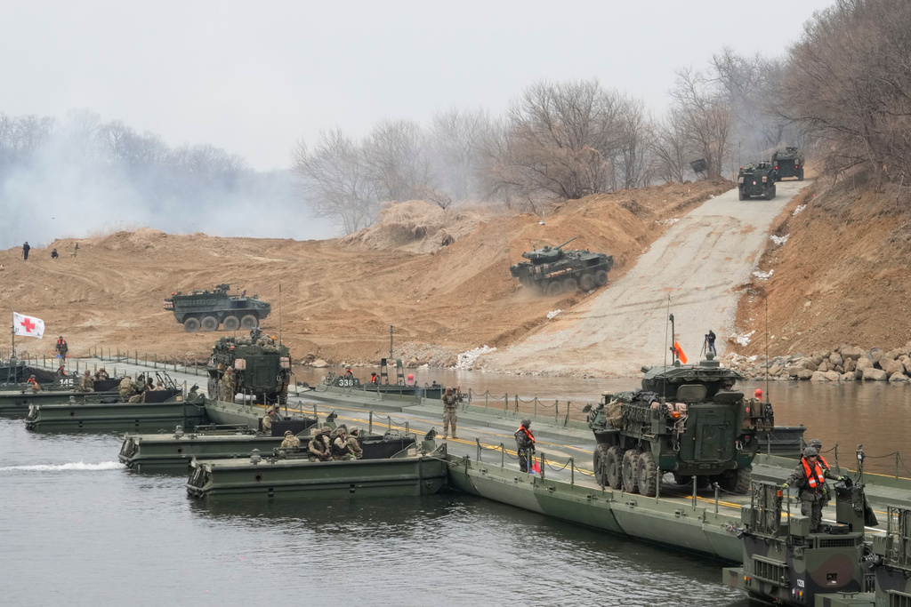 U.S. Army's armored vehicles cross a floating bridge on the Imjin River during a joint river-crossing exercise between South Korea and the United States as a part of the Freedom Shield military exercise in Yeoncheon, South Korea, Saturday, March 14, 2026. (AP Photo/Ahn Young-joon)