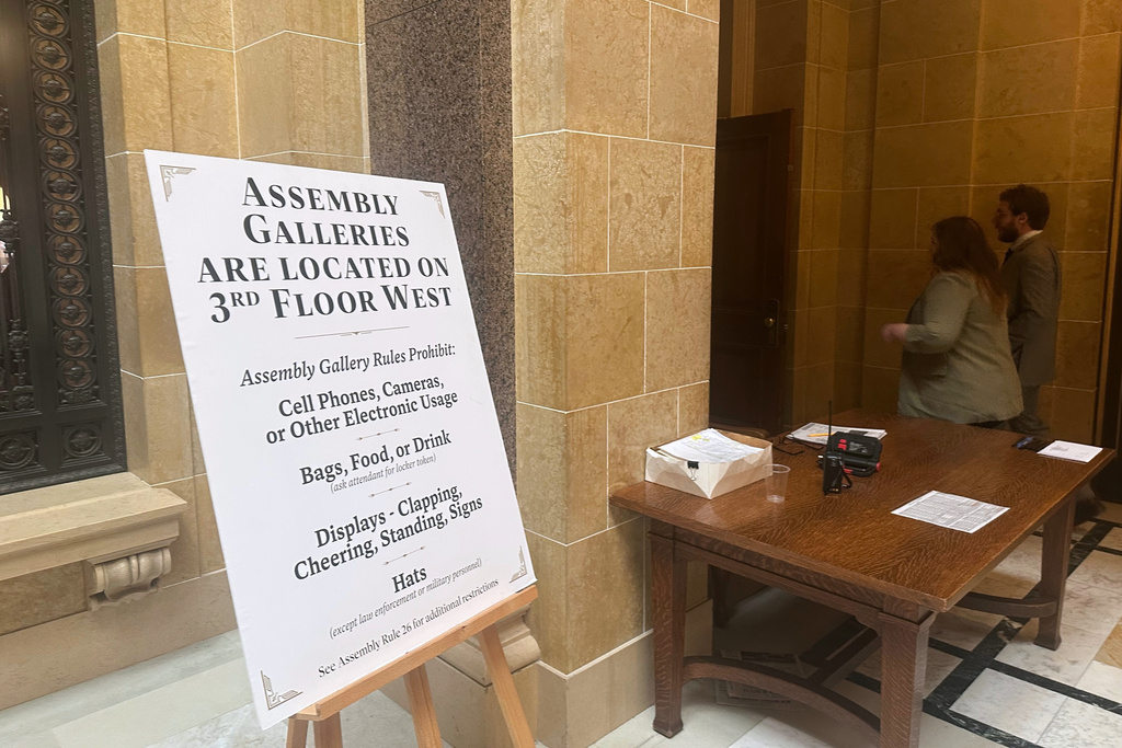 A sign outside of the Wisconsin Assembly chamber reminds visitors of a prohibition on livestreaming or taking video of lawmakers' debate on Thursday, Jan. 22, 2026, in Madison, Wis. (AP Photo/Scott Bauer)
