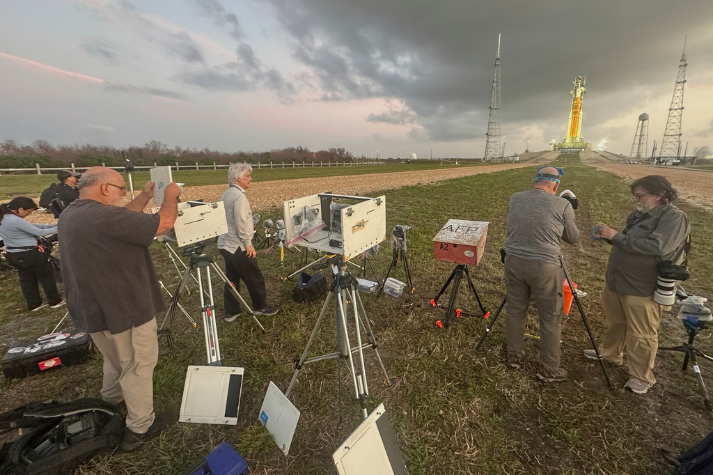 Photographers set up remote cameras to capture the launch of NASA's Artemis II SLS (Space Launch System) rocket with the Orion spacecraft is seen at Launch Complex 39B at the Kennedy Space Center, Tuesday, March 31, 2026, in Cape Canaveral, Fla. (AP Photo/John Raoux)