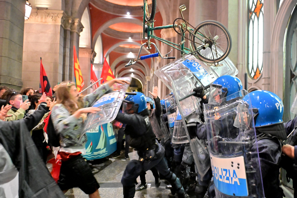Police faceoff against people protesting in solidarity with the Global Sumud Flotilla on Wednesday, Oct. 1, 2025, in Turin, Italy, after ships were intercepted by the Israeli navy. (Matteo Secci/LaPresse via AP)