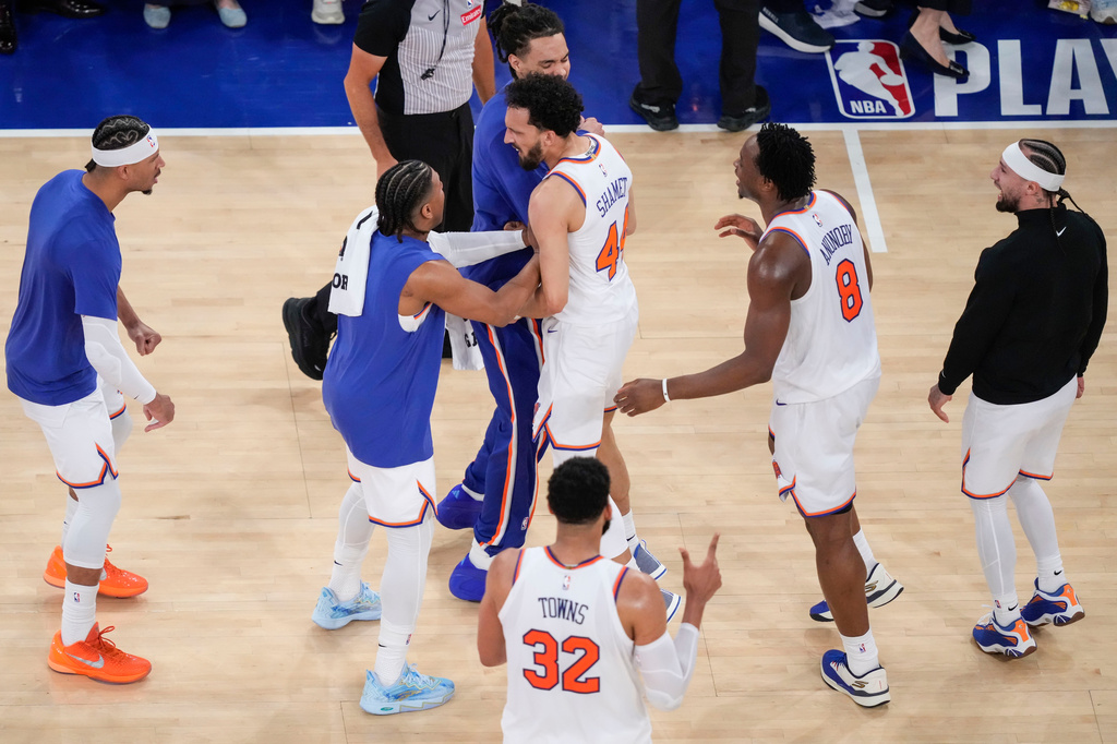 New York Knicks guard Landry Shamet (44) celebrates with teammates after scoring a three-point basket during the first overtime of Game 1 in the Eastern Conference finals NBA basketball playoffs series against the Cleveland Cavaliers, Tuesday, May 19, 2026, in New York. (AP Photo/Yuki Iwamura)