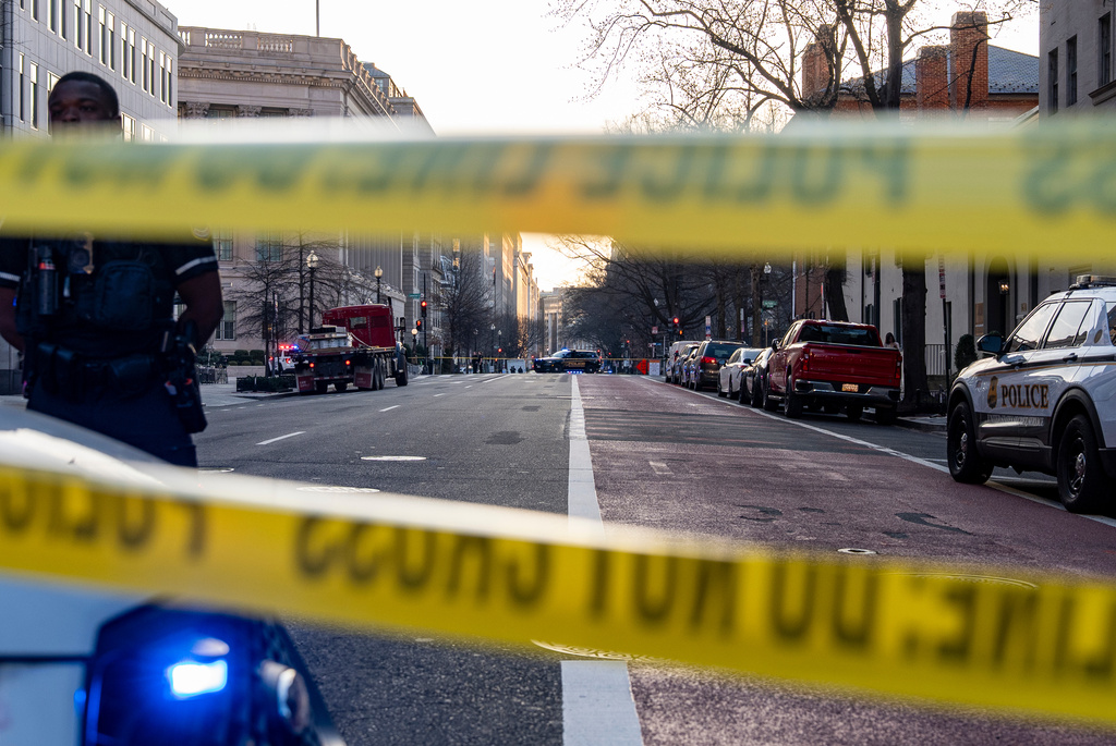 Washington Metropolitan Police Department officers block the streets around the White House as members of the U.S. Secret Service investigate a suspicious vehicle, Wednesday, March 11, 2026, in Washington. (AP Photo/Alex Brandon)