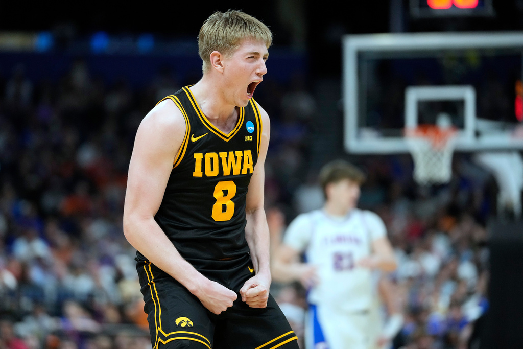 Iowa forward Cooper Koch (8) celebrates a three-point shot during the second half in the second round of the NCAA college basketball tournament against Florida Sunday, March 22, 2026, in Tampa, Fla. (AP Photo/Chris O'Meara)