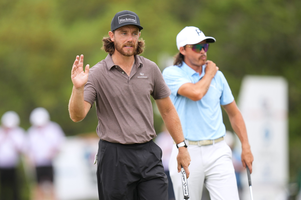 Tommy Fleetwood, left, reacts to his birdie putt on the eighth hole during the first round of the Valero Texas Open golf tournament in San Antonio, Thursday, April 2, 2026. (AP Photo/Eric Gay)