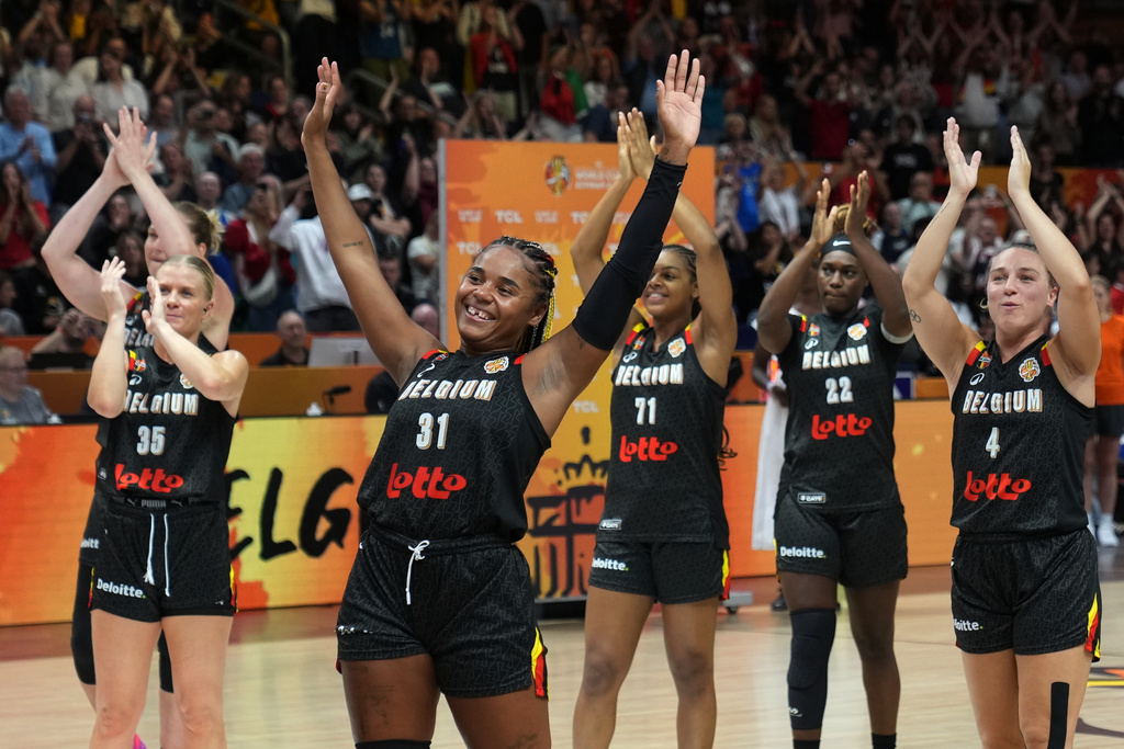Belgian players celebrate after the Women's Basketball World Cup match between Puerto Rico and Belgium in Berlin, Sunday, Sept. 6, 2026. (AP Photo/Ebrahim Noroozi)