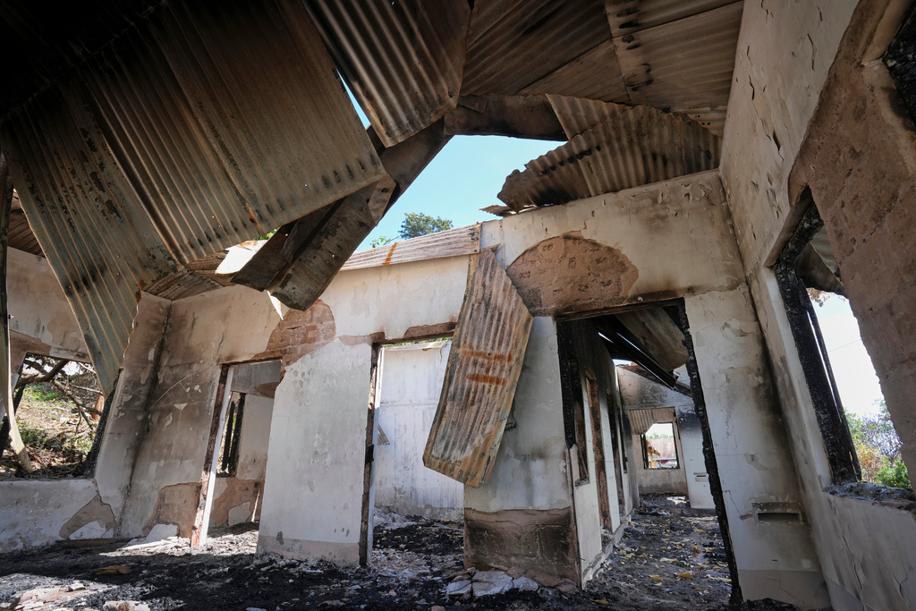 In this photo taken during a trip supervised by pro-military Myanmar media, a damaged government residence is seen in Kyaukme, northern Shan State, Myanmar, Friday, Oct. 10, 2025. (AP Photo/Aung Shine Oo)