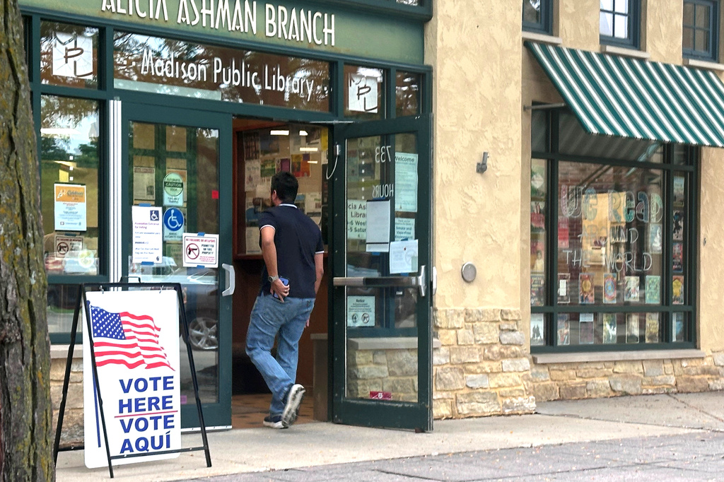 Wisconsin voters walk into a polling place where the primary race for governor has pitted more moderate Democrats against a progressive challenger, on Tuesday, August 11, 2026, in Madison, Wisc. (AP Photo/Scott Bauer)