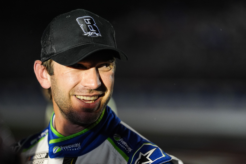 Daniel Suarez smiles after winning a NASCAR Cup Series auto race, Sunday, May 24, 2026, in Charlotte, N.C. (AP Photo/Matt Kelley)