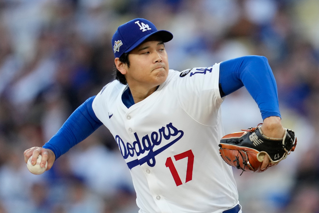 Los Angeles Dodgers pitcher Shohei Ohtani throws against the Milwaukee Brewers during the first inning in Game 4 of baseball's National League Championship Series, Friday, Oct. 17, 2025, in Los Angeles. (AP Photo/Ashley Landis)