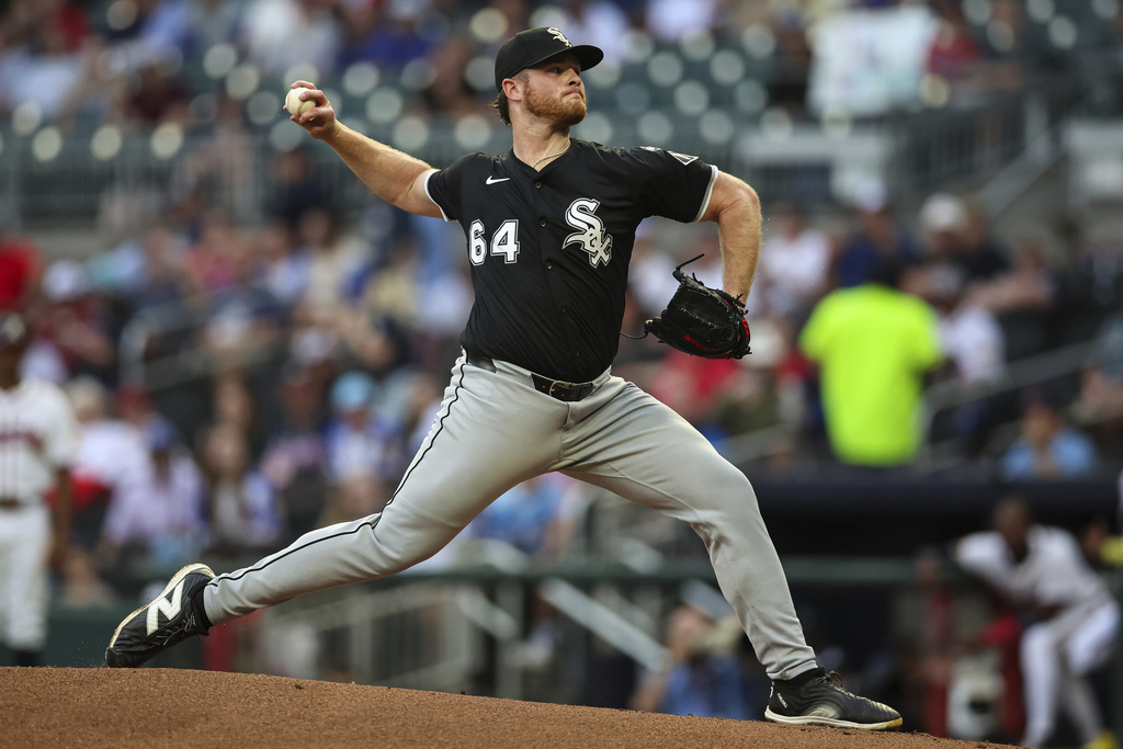 Chicago White Sox pitcher Shane Smith (64) delivers in the first inning of a baseball game against the Atlanta Braves, Tuesday, Aug. 19, 2025, in Atlanta. (AP Photo/Colin Hubbard)