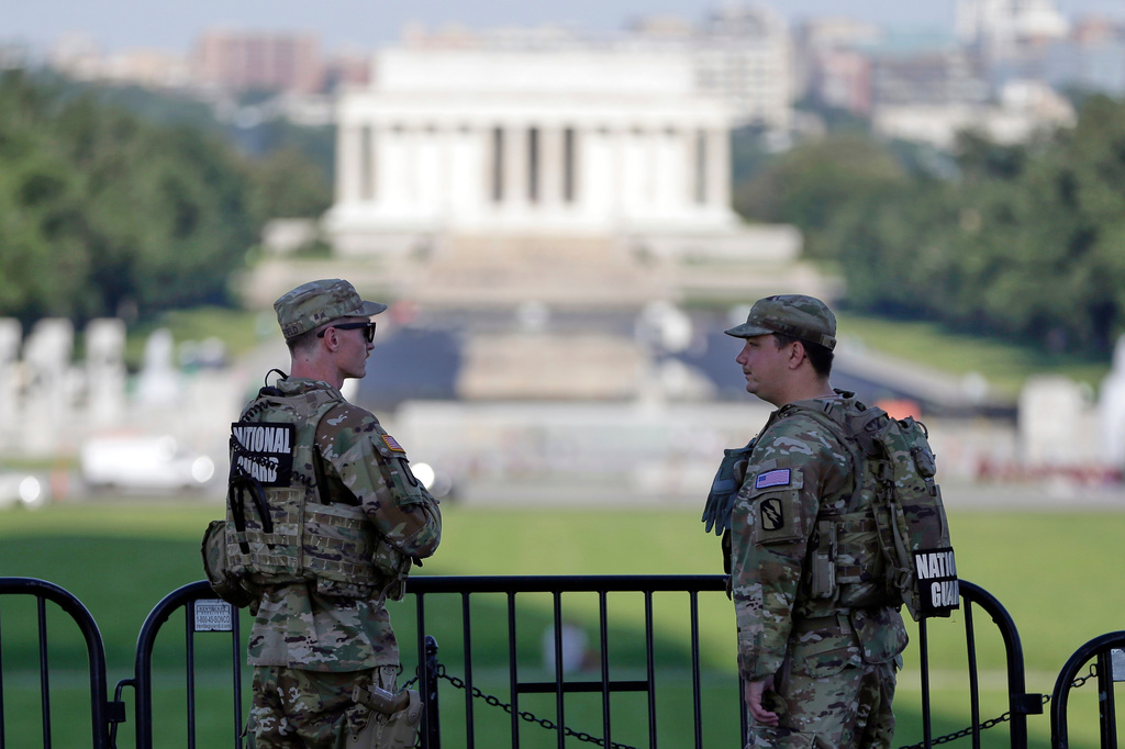 National Guard soldiers patrol at the base of the Washington Monument, on Friday, June 5, 2026, in Washington, looking toward the Lincoln Memorial. (AP Photo/Rahmat Gul)